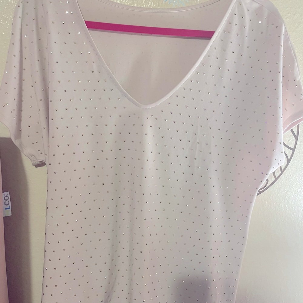 Beautiful Jennifer Lopez blouse size XA but fits more like a medium